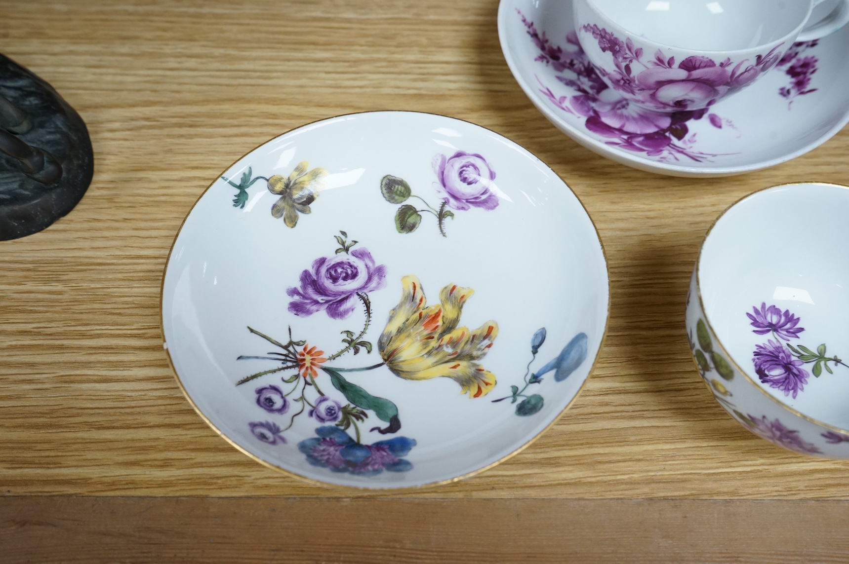 Two 18th century Meissen floral decorated teacups and saucers, largest saucer 13.5cm diameter